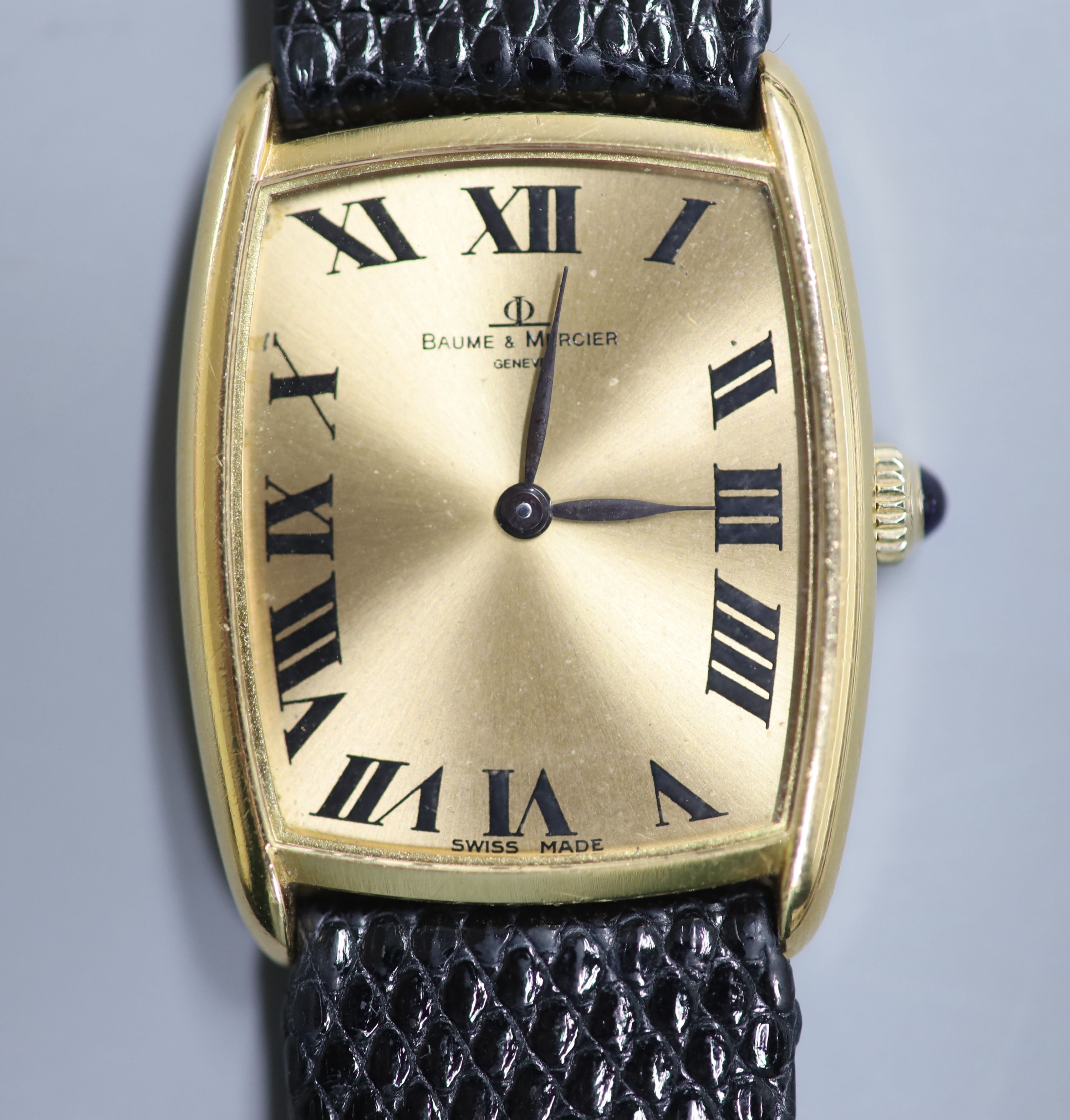 A gentlemans stylish 18k Baume & Mercier manual wind dress wrist watch, on associated leather strap,